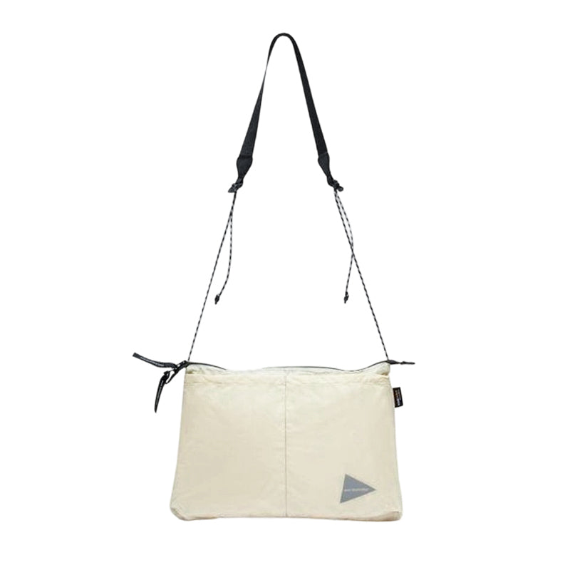 AND WANDER | Sil Sacoche OFF WHITE