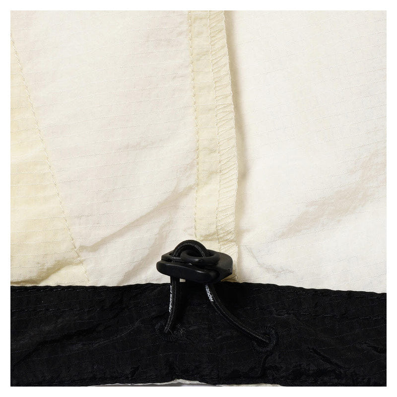 AND WANDER | x ROA Ripstop Wnd Jacket Off White